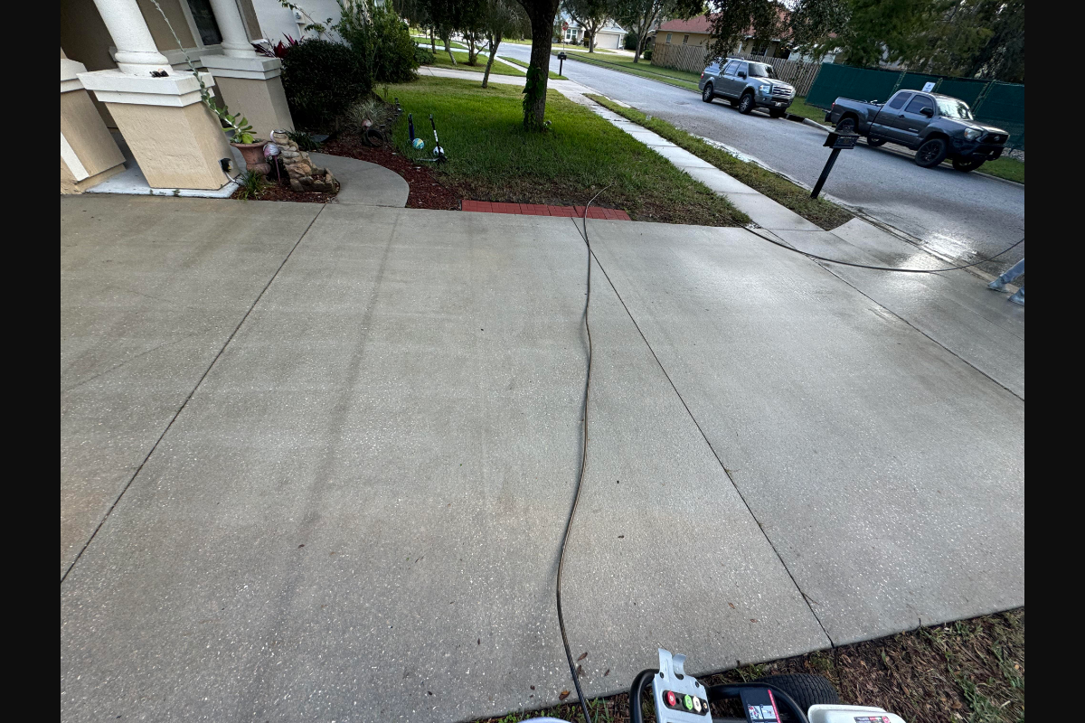Pressure washing a concrete driveway clean in Marion Ohio